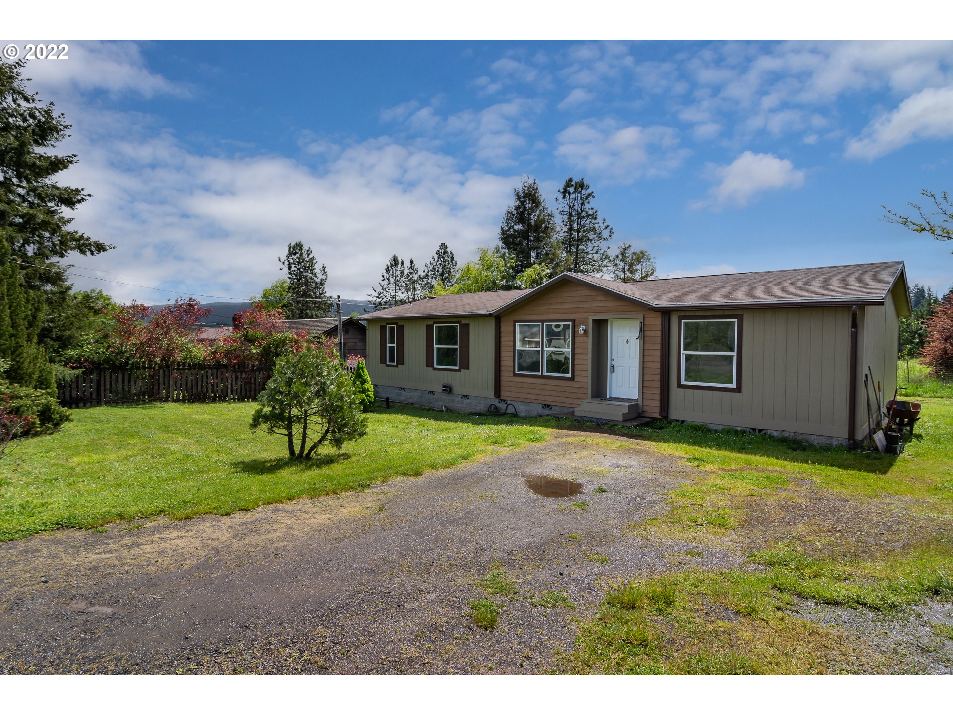692 Mathis Hill Road Yoncalla, OR 97499 - Photo 2 of 31 a view of a yard in front of a house with a yard
