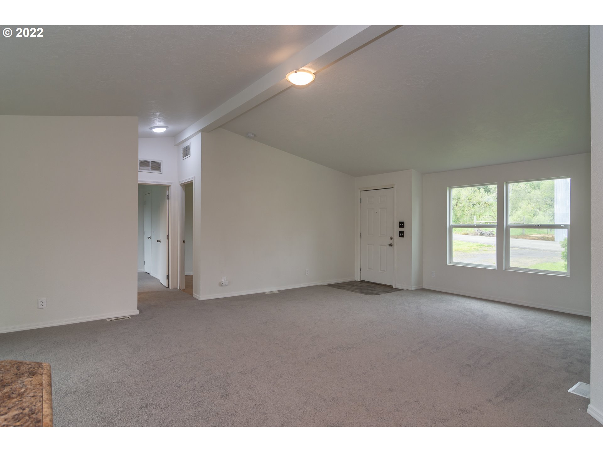 692 Mathis Hill Road Yoncalla, OR 97499 - Photo 21 of 31 a view of an empty room with a window