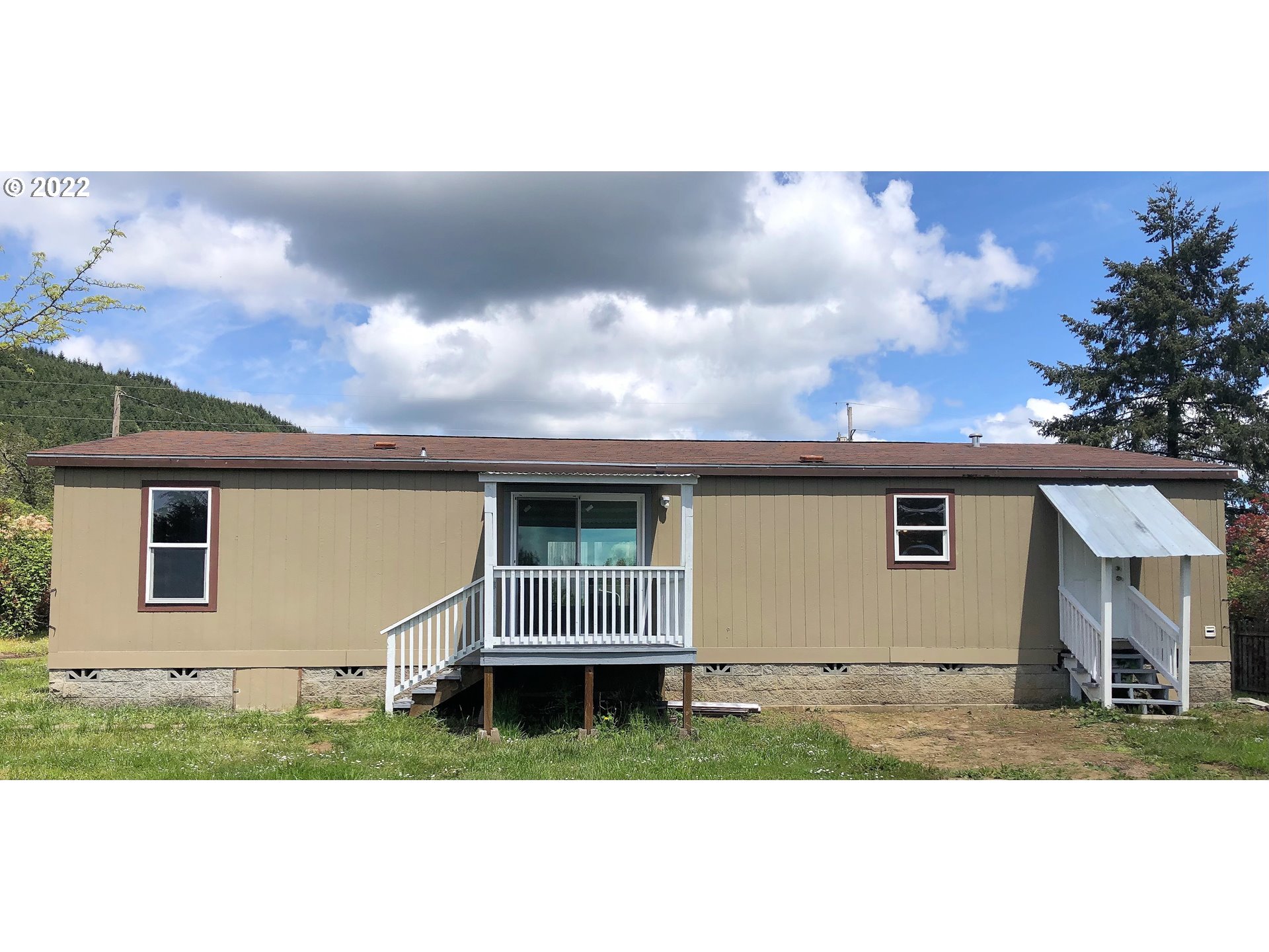 692 Mathis Hill Road Yoncalla, OR 97499 - Photo 29 of 31 a view of house with backyard