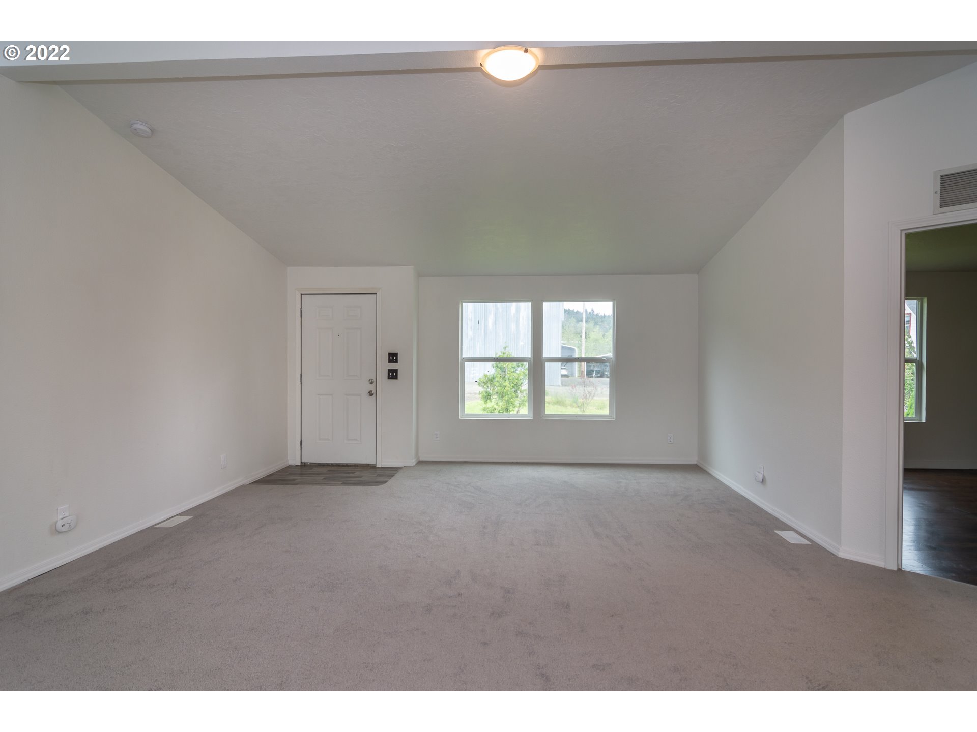 692 Mathis Hill Road Yoncalla, OR 97499 - Photo 8 of 31 a view of an empty room with a window