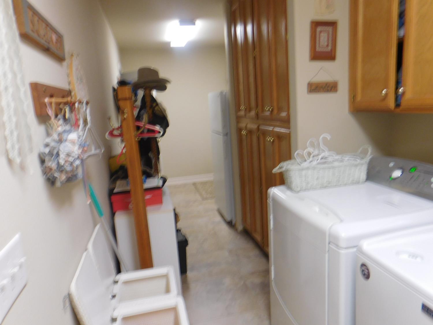 3215 Tragon Street Madera, CA 93637 - Photo 11 of 13 a bathroom with a sink and mirror