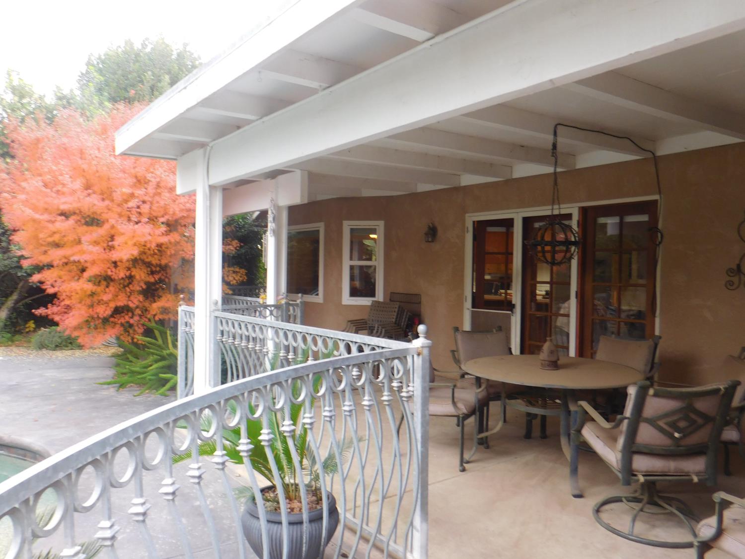 3215 Tragon Street Madera, CA 93637 - Photo 12 of 13 a view of a chair and tables in the balcony
