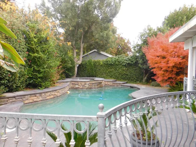 a view of swimming pool from a balcony