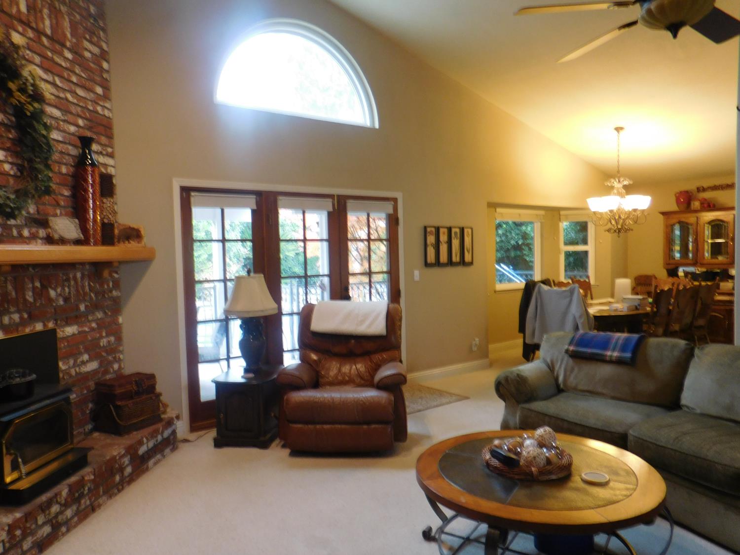 3215 Tragon Street Madera, CA 93637 - Photo 6 of 13 a living room with furniture and a fireplace