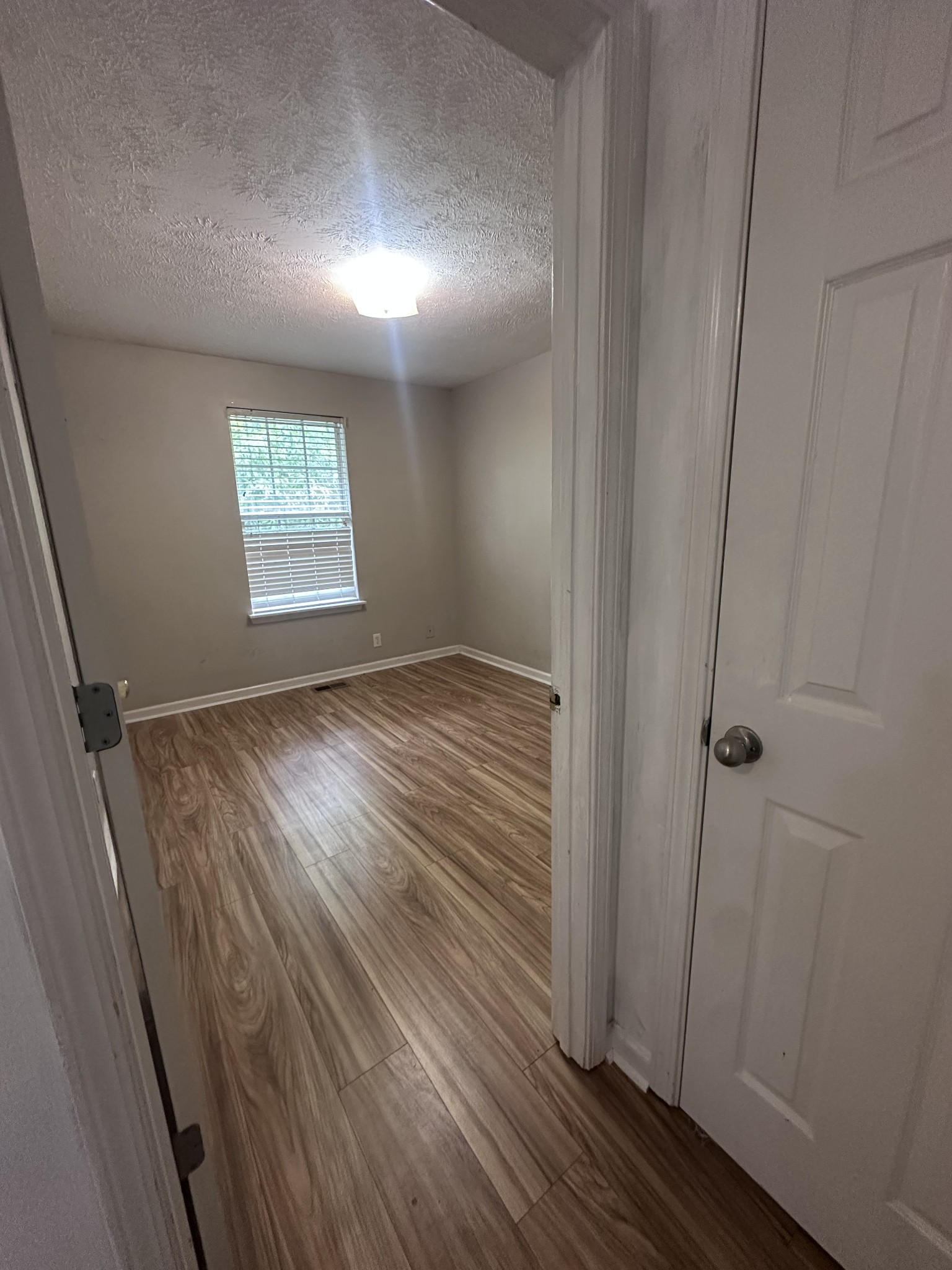 3001 Hamilton Church Road, Unit 403 Antioch, TN 37013 - Photo 21 of 21 an empty room with wooden floor and windows