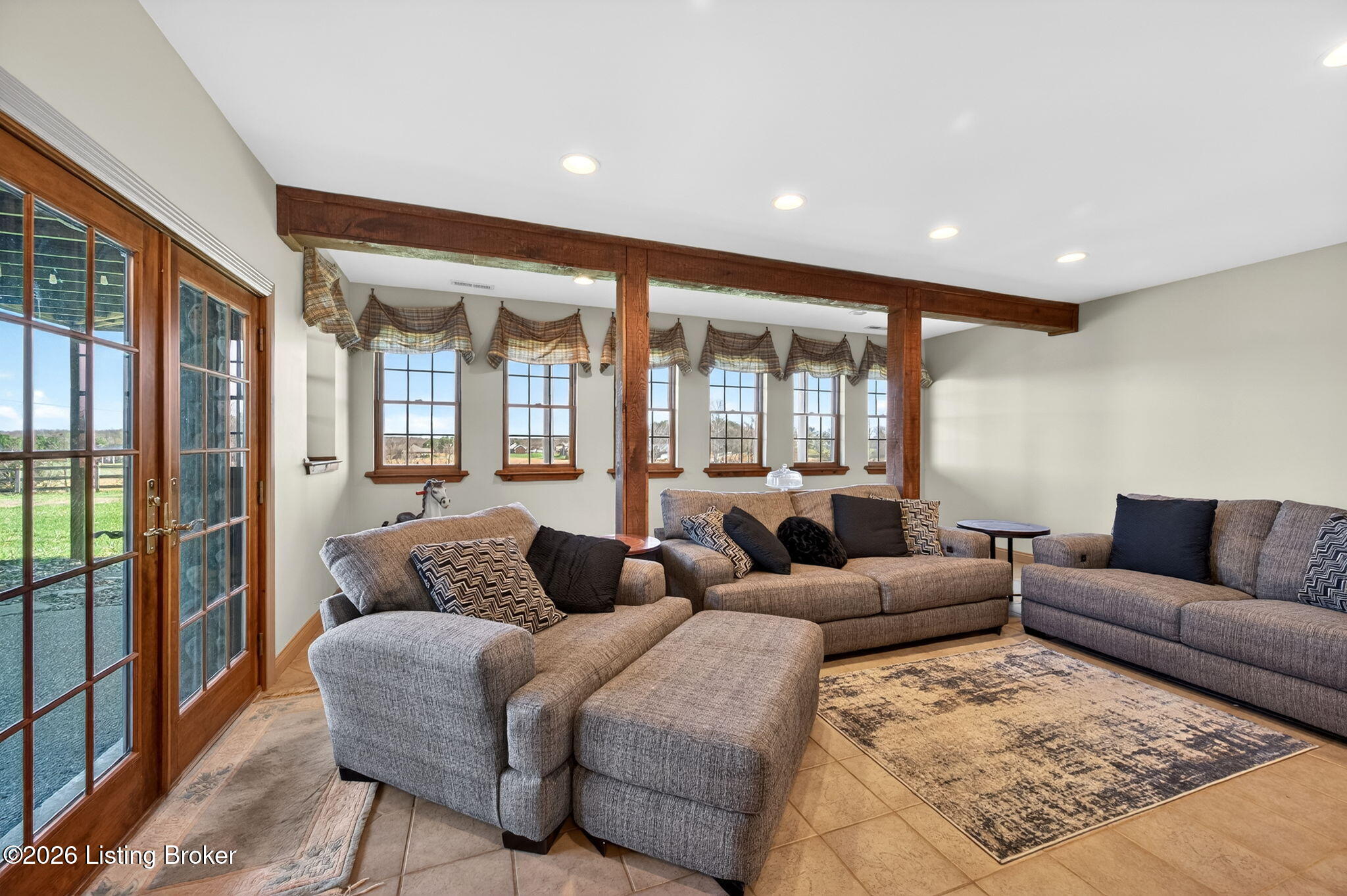 771 Mud Splash Road Elizabethtown, KY 42701 - Photo 60 of 85 This walkout lower level highlights an atrium door and a bank of rear windows overlooking the back patio and the gorgeous outdoor space beyond
