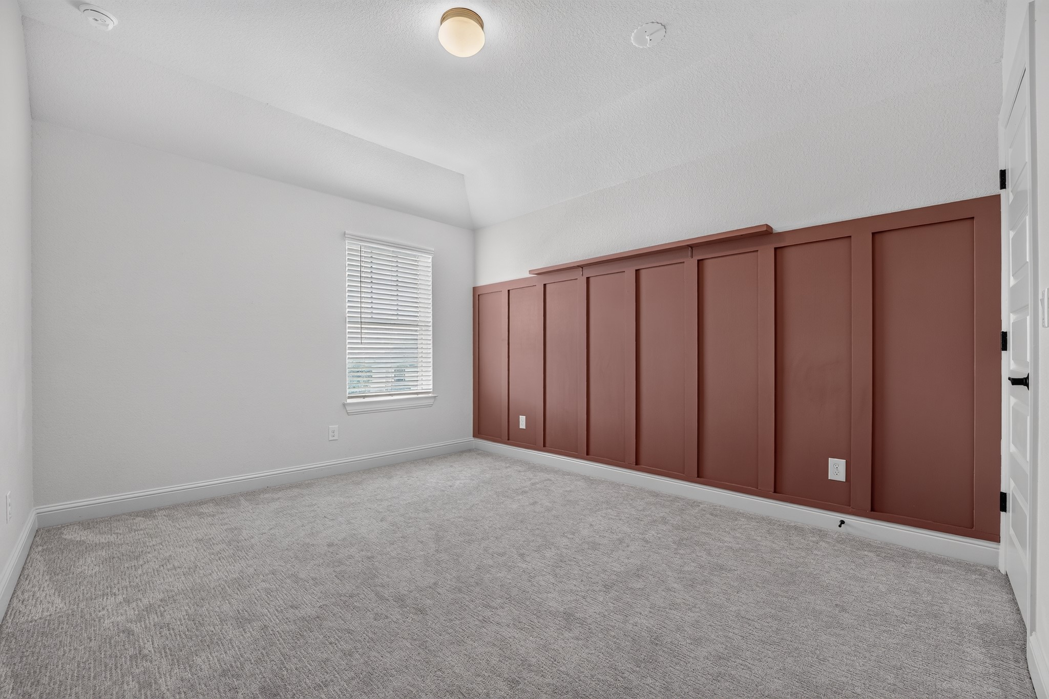 508 Pinnacle View Drive Georgetown, TX 78628 - Photo 14 of 27 A well-lit bedroom features plush carpeting and a striking accent wall.