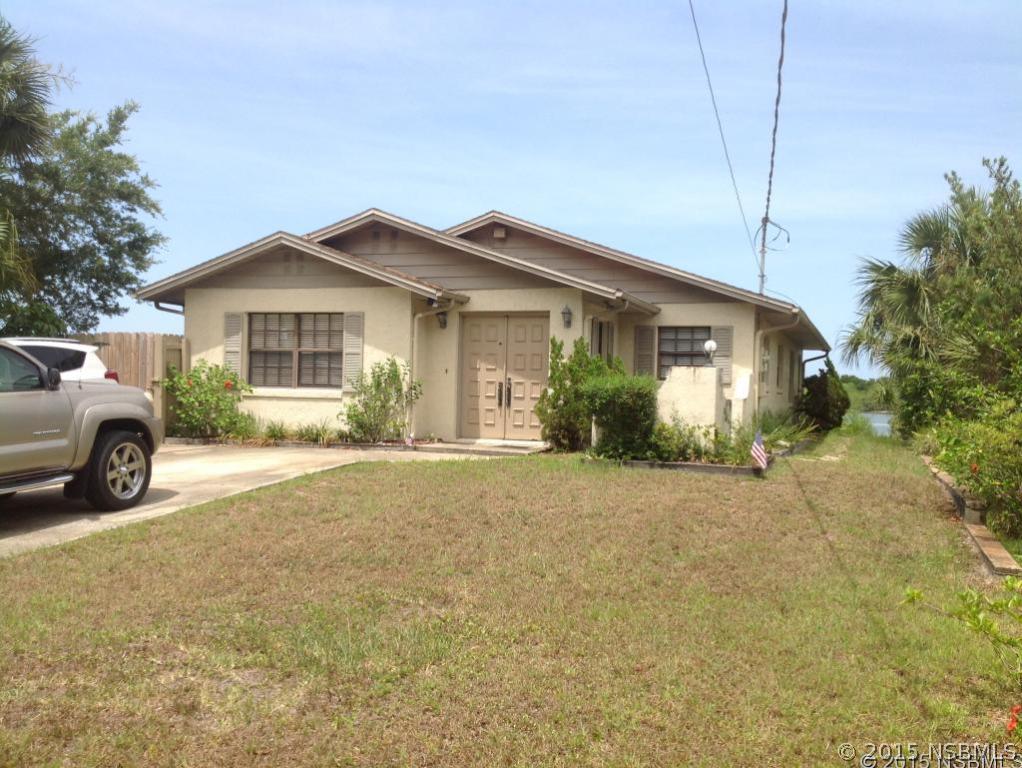 1307 South Riverside Drive Edgewater, FL 32132 - Photo 2 of 8 a view of a house with a patio and plants