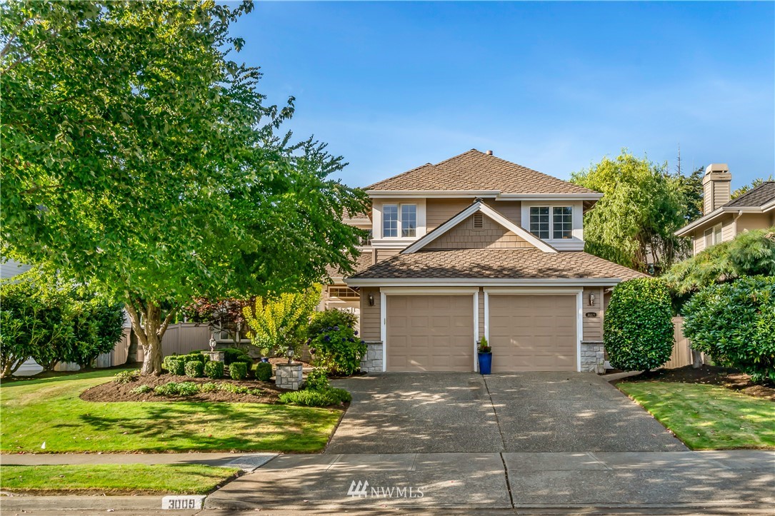 3009 214th Street Southeast Bothell, WA 98021 - Photo 1 of 36 a front view of a house with a yard