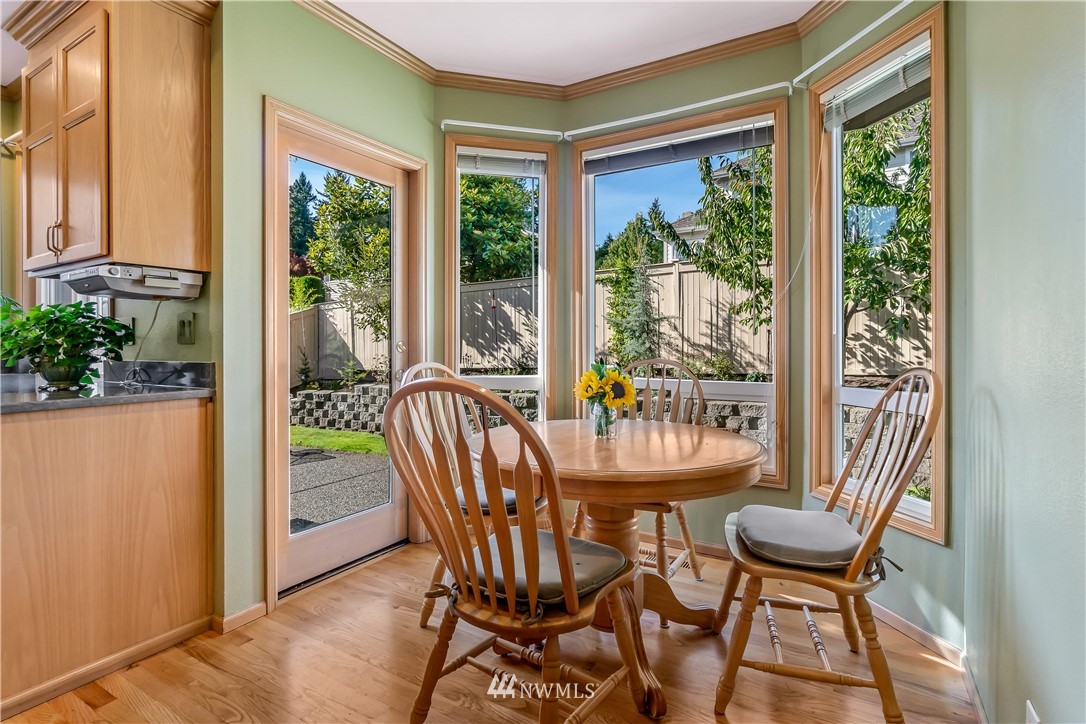 3009 214th Street Southeast Bothell, WA 98021 - Photo 17 of 36 a view of a dining room with furniture window and outside view