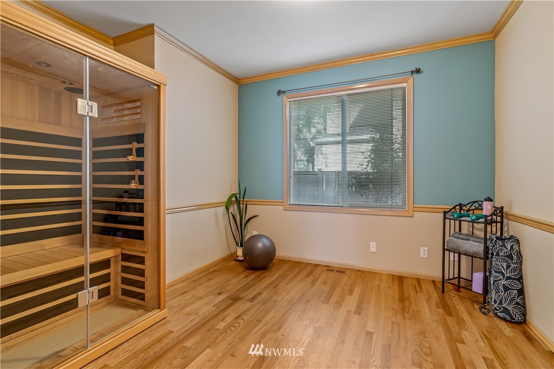 3009 214th Street Southeast Bothell, WA 98021 - Photo 21 of 36 a view of a room with wooden floor and windows
