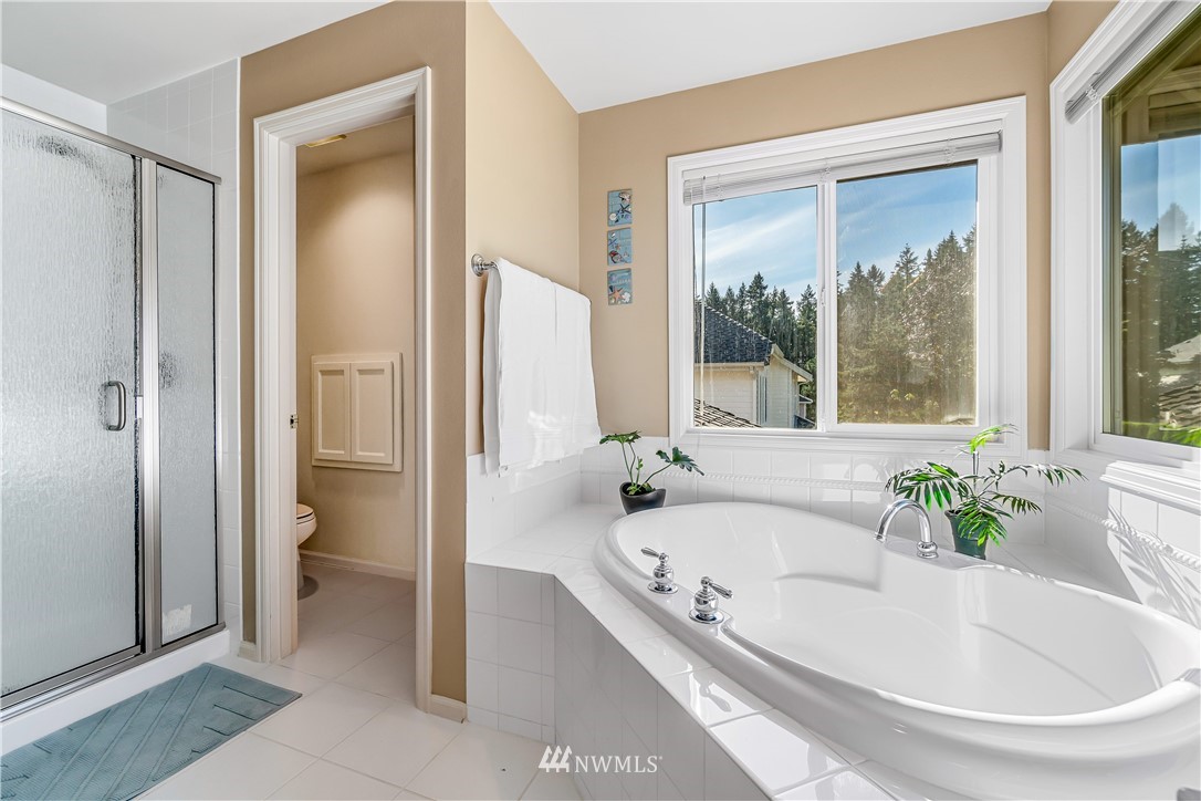 3009 214th Street Southeast Bothell, WA 98021 - Photo 26 of 36 a white bath tub sitting next to a window