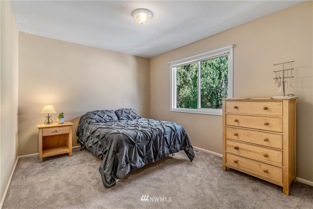 3009 214th Street Southeast Bothell, WA 98021 - Photo 27 of 36 a bedroom with a bed and a window