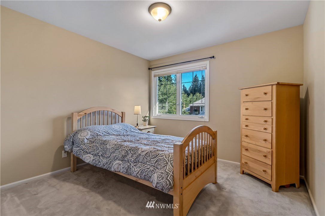 3009 214th Street Southeast Bothell, WA 98021 - Photo 28 of 36 a bedroom with a bed and a window