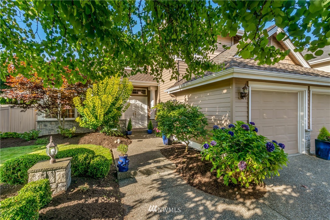 3009 214th Street Southeast Bothell, WA 98021 - Photo 4 of 36 a front view of a house with garden