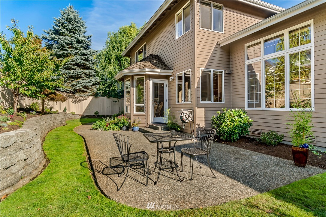 3009 214th Street Southeast Bothell, WA 98021 - Photo 31 of 36 a view of a house with backyard sitting area and garden