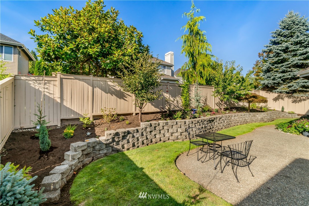 3009 214th Street Southeast Bothell, WA 98021 - Photo 34 of 36 a view of a backyard with plants and a patio