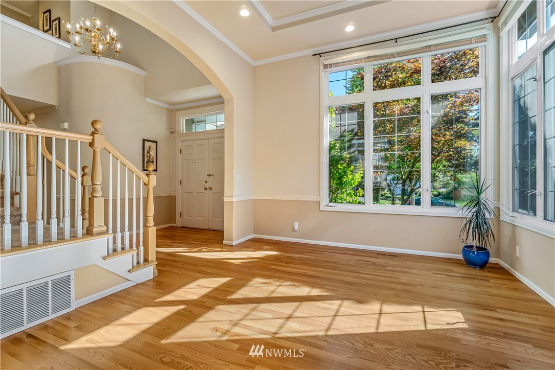 3009 214th Street Southeast Bothell, WA 98021 - Photo 6 of 36 a view of an empty room with wooden floor and a window