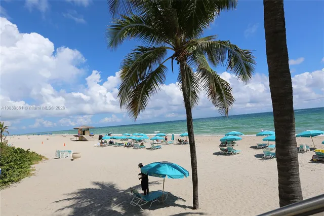 a kitchen with a stove and white cabinets
