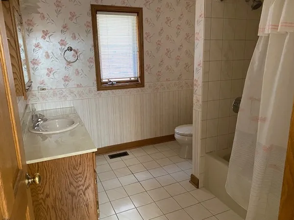 a bathroom with a sink and a toilet