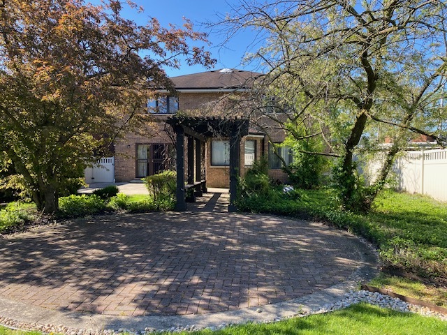 812 Elm Street Park Ridge, IL 60068 - Photo 21 of 22 a front view of a house with garden