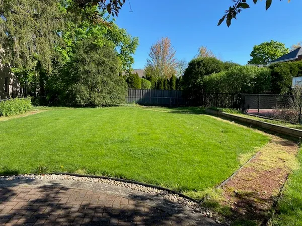 a view of a backyard with a garden