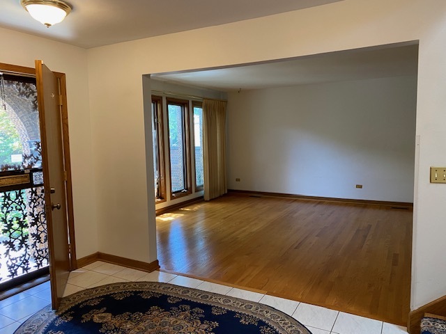 812 Elm Street Park Ridge, IL 60068 - Photo 4 of 22 an empty room with wooden floor and windows