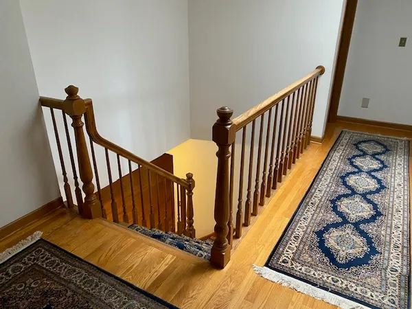 a view of a hallway with staircase