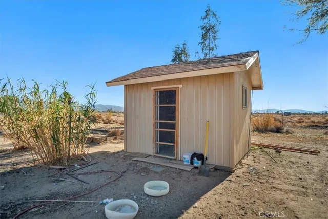 a view of yard with wooden fence