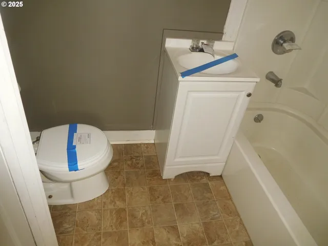 a bathroom with a bathtub sink and toilet