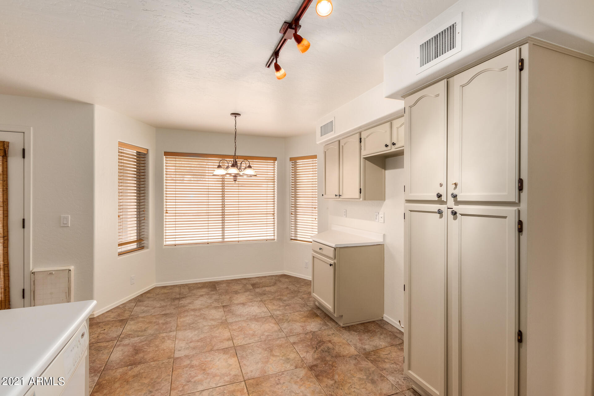 4244 East Raven Road Phoenix, AZ 85044 - Photo 13 of 31 a view of a kitchen with a sink and cabinet area
