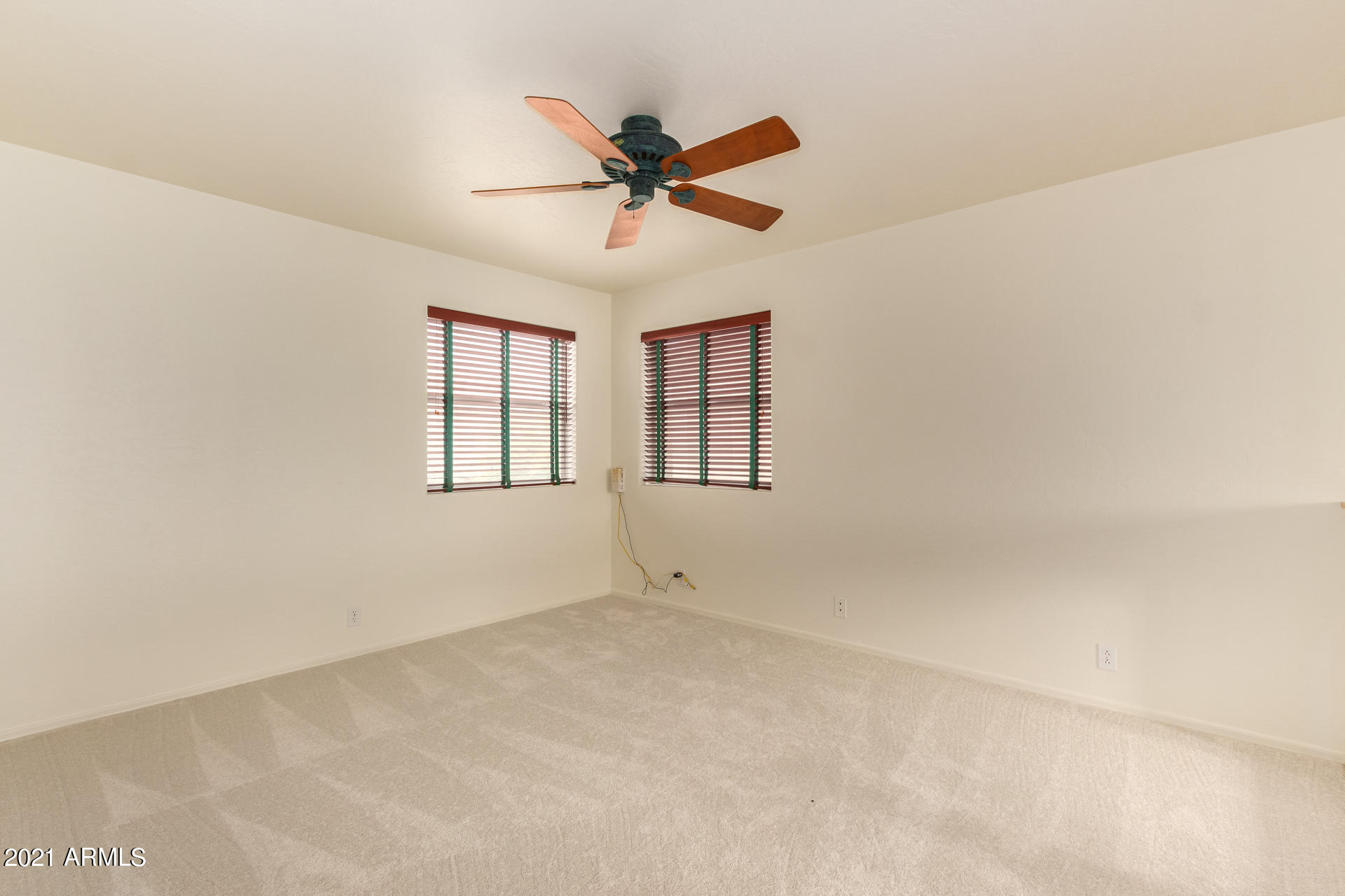 4244 East Raven Road Phoenix, AZ 85044 - Photo 19 of 31 a view of an empty room with a window