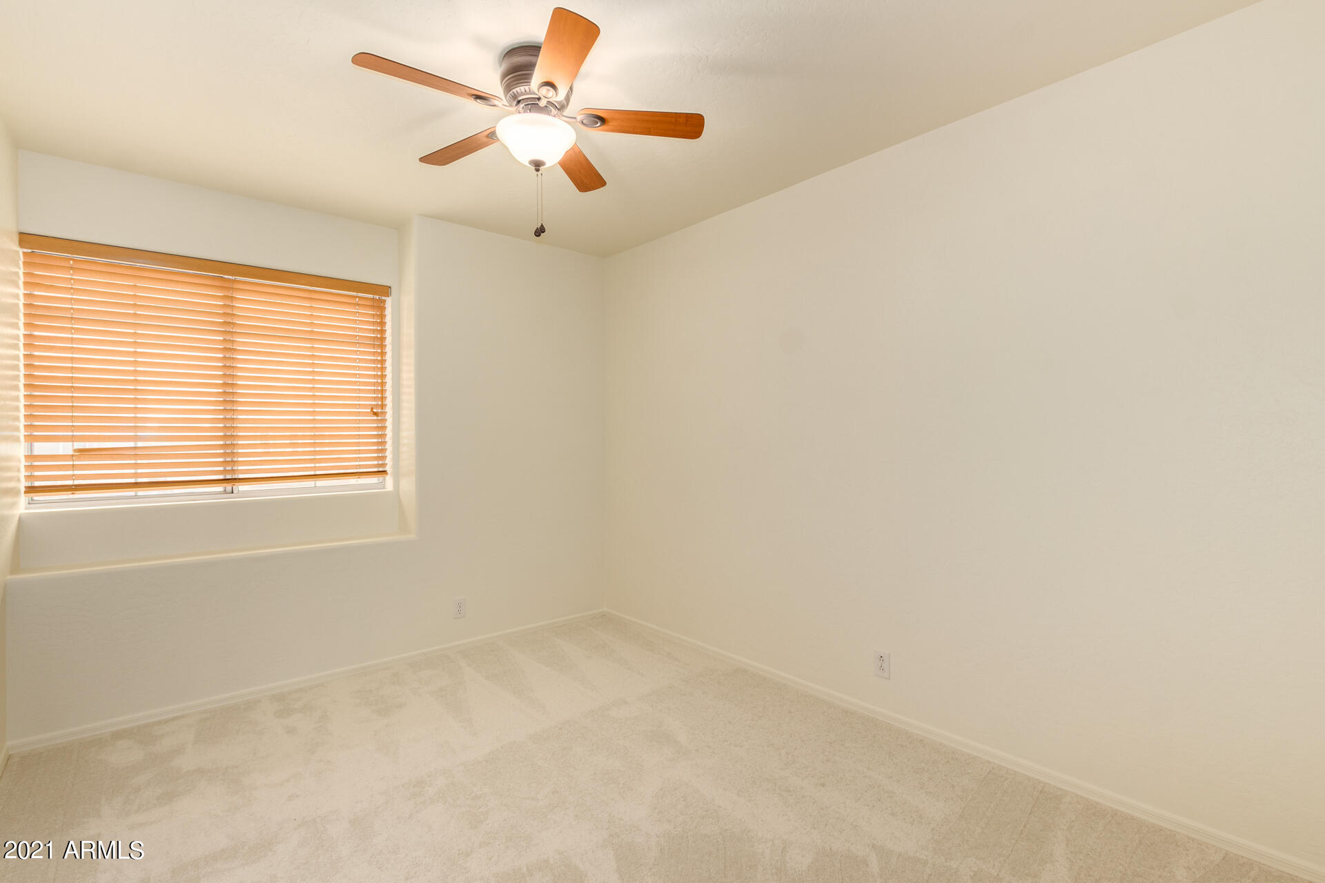 4244 East Raven Road Phoenix, AZ 85044 - Photo 21 of 31 a view of an empty room with a window