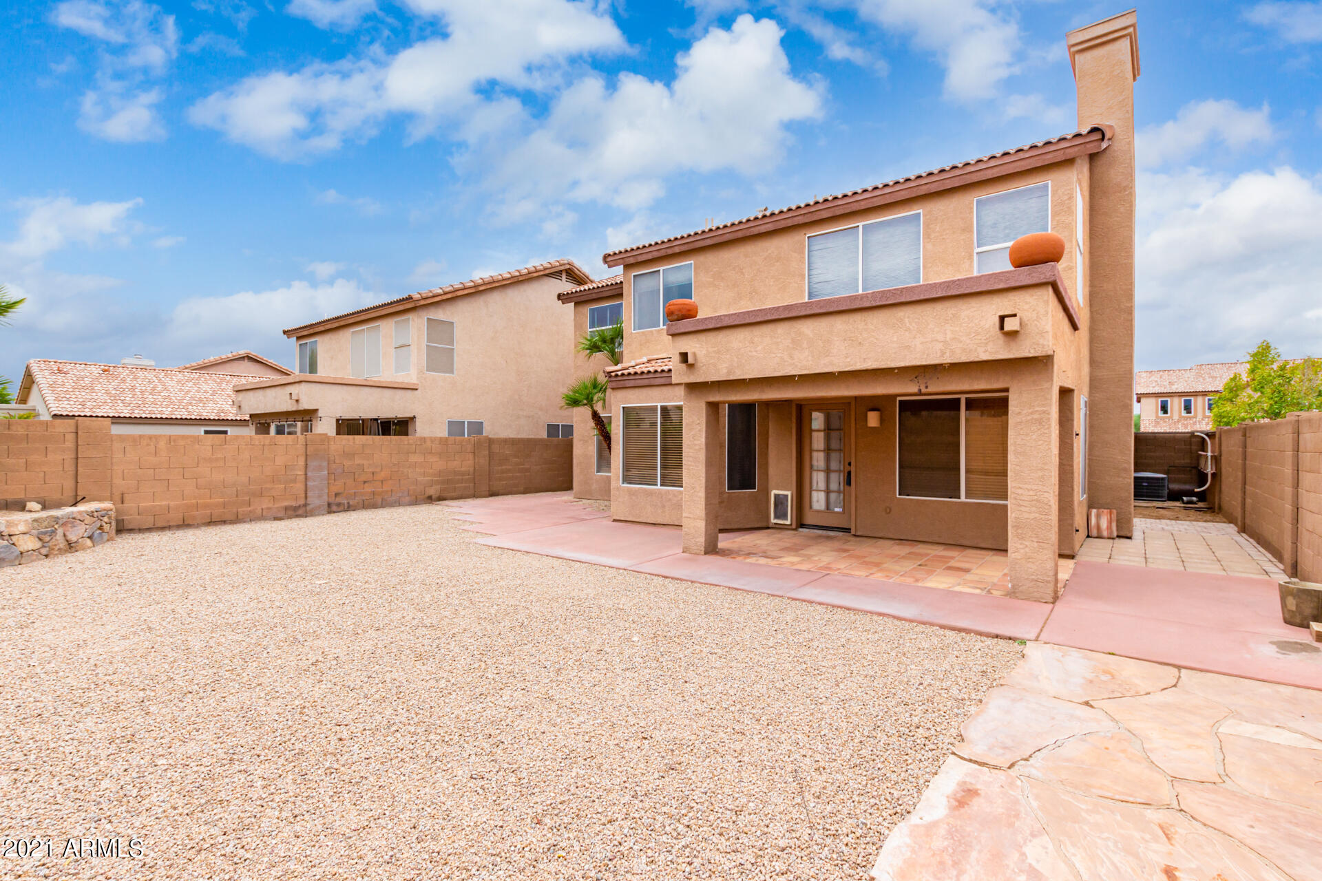 4244 East Raven Road Phoenix, AZ 85044 - Photo 24 of 31 a front view of a house with a yard and garage