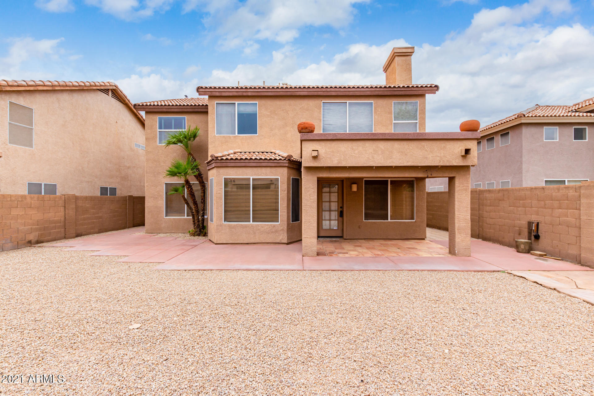 4244 East Raven Road Phoenix, AZ 85044 - Photo 26 of 31 a front view of a house with a yard