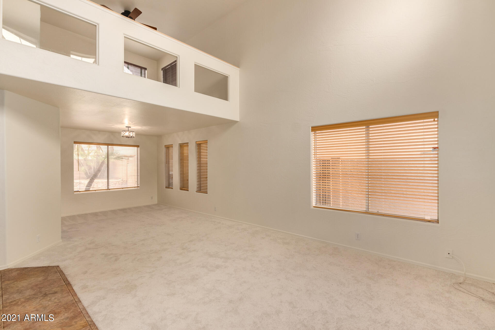 4244 East Raven Road Phoenix, AZ 85044 - Photo 3 of 31 an empty room with windows