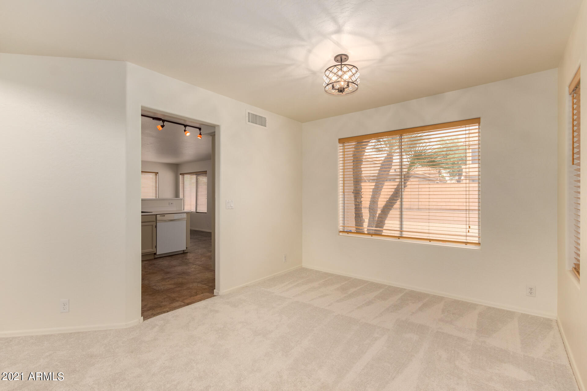 4244 East Raven Road Phoenix, AZ 85044 - Photo 5 of 31 a view of an empty room with a window