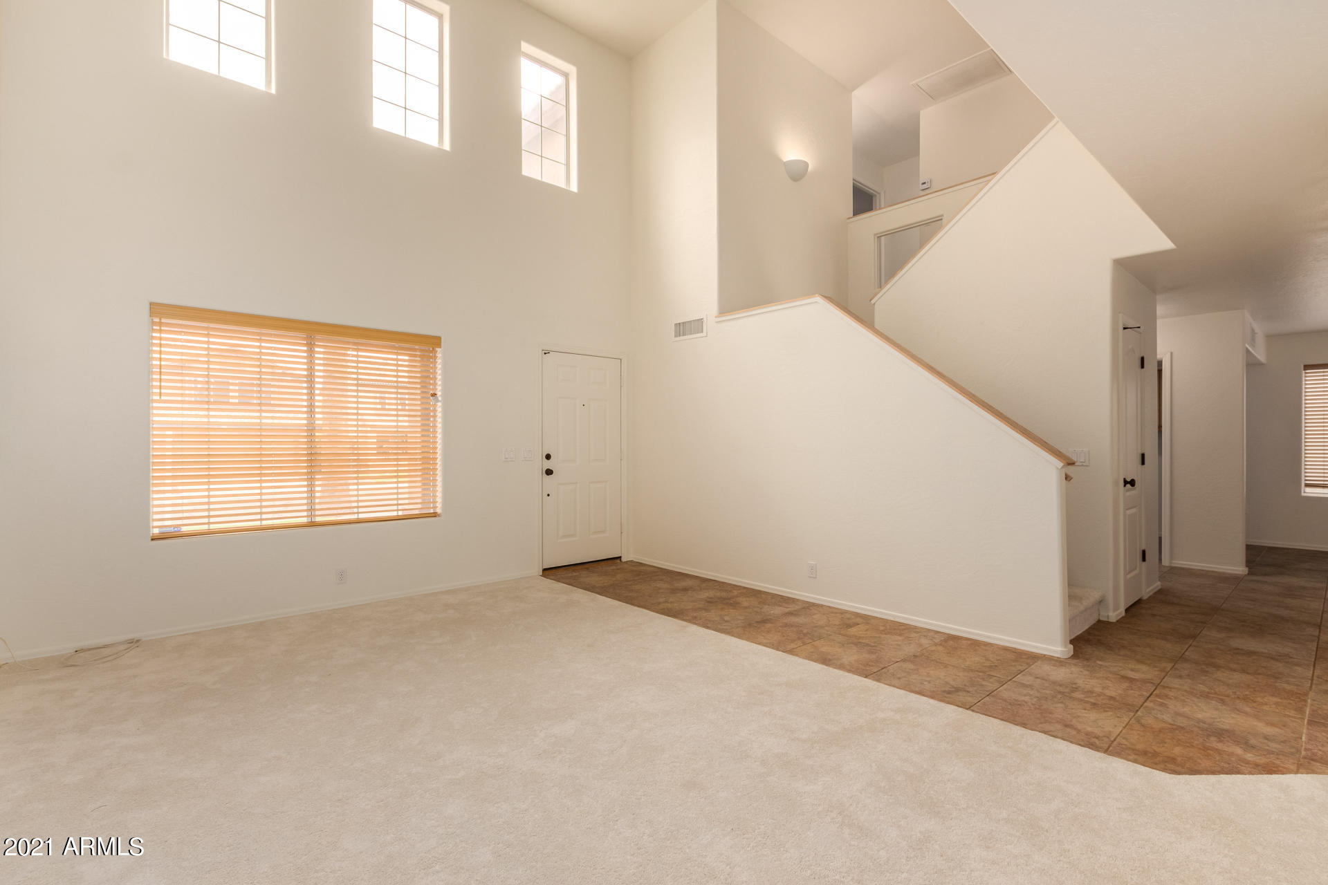 4244 East Raven Road Phoenix, AZ 85044 - Photo 6 of 31 an empty room with windows
