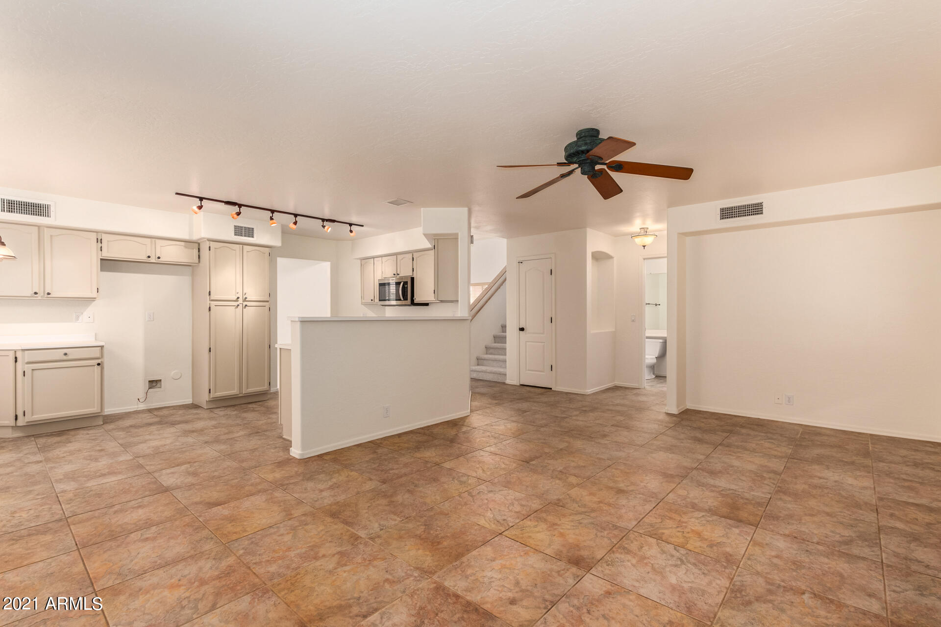4244 East Raven Road Phoenix, AZ 85044 - Photo 8 of 31 a view of a kitchen with a sink and a refrigerator