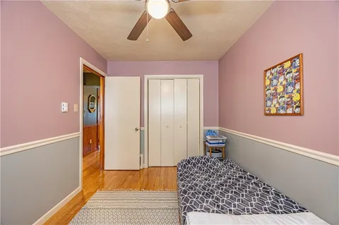 a bedroom with a bed and a walk in closet