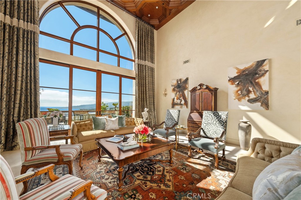 32040 Cape Point Drive Rancho Palos Verdes, CA 90275 - Photo 14 of 70 a living room with furniture and a floor to ceiling window