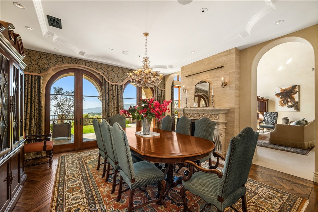 32040 Cape Point Drive Rancho Palos Verdes, CA 90275 - Photo 21 of 70 a view of a dining room with furniture and a chandelier