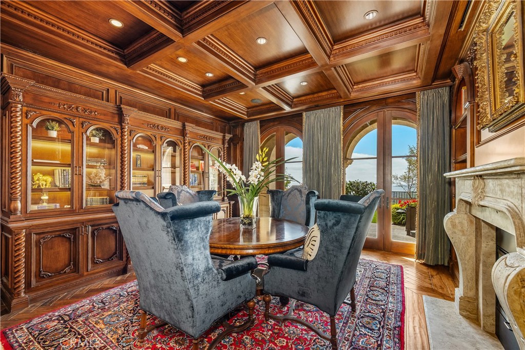 32040 Cape Point Drive Rancho Palos Verdes, CA 90275 - Photo 24 of 70 a dining room with furniture wooden floor a rug and a chandelier
