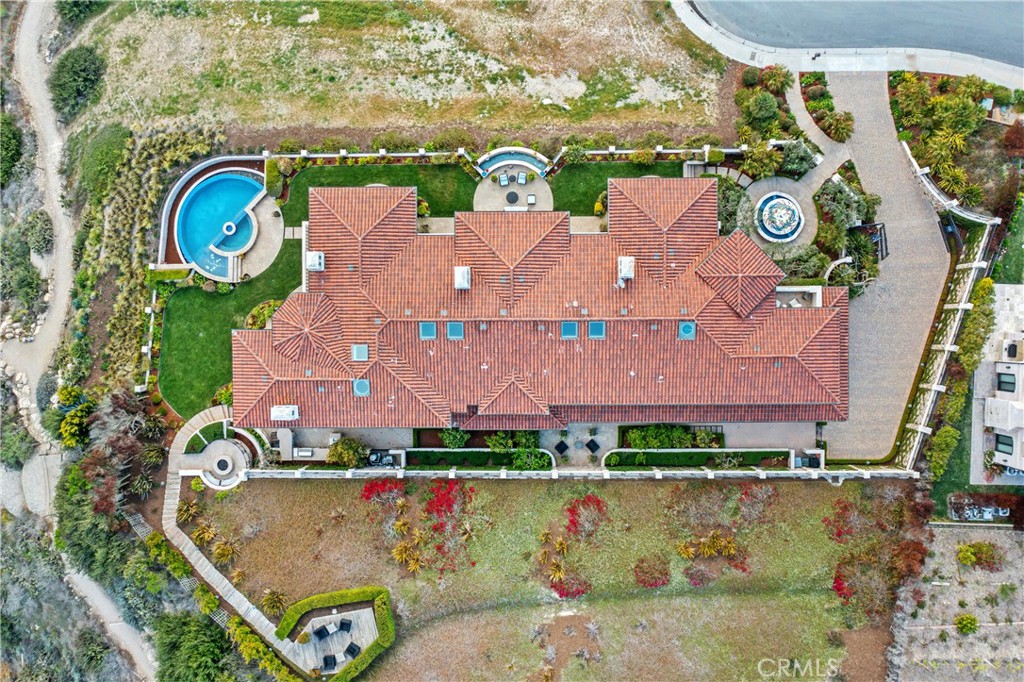 32040 Cape Point Drive Rancho Palos Verdes, CA 90275 - Photo 26 of 70 an aerial view of a house with a swimming pool a yard and a fountain