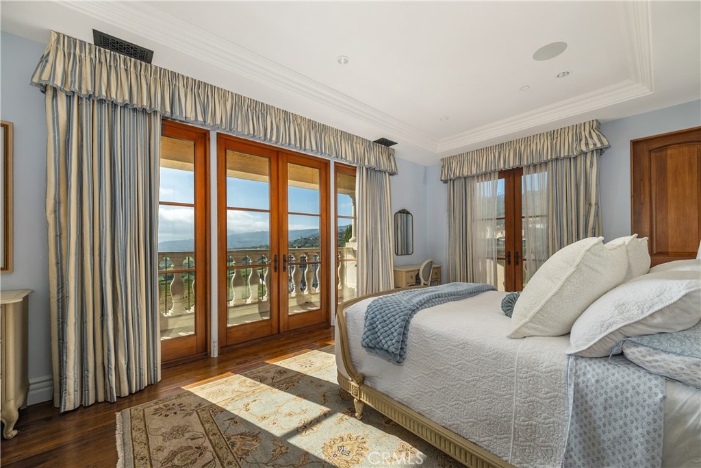 32040 Cape Point Drive Rancho Palos Verdes, CA 90275 - Photo 50 of 70 a bedroom with a large bed and a large window