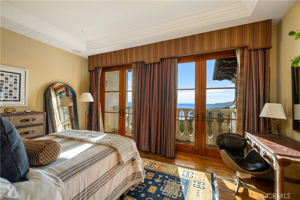 32040 Cape Point Drive Rancho Palos Verdes, CA 90275 - Photo 52 of 70 a bedroom with a bed and a large window
