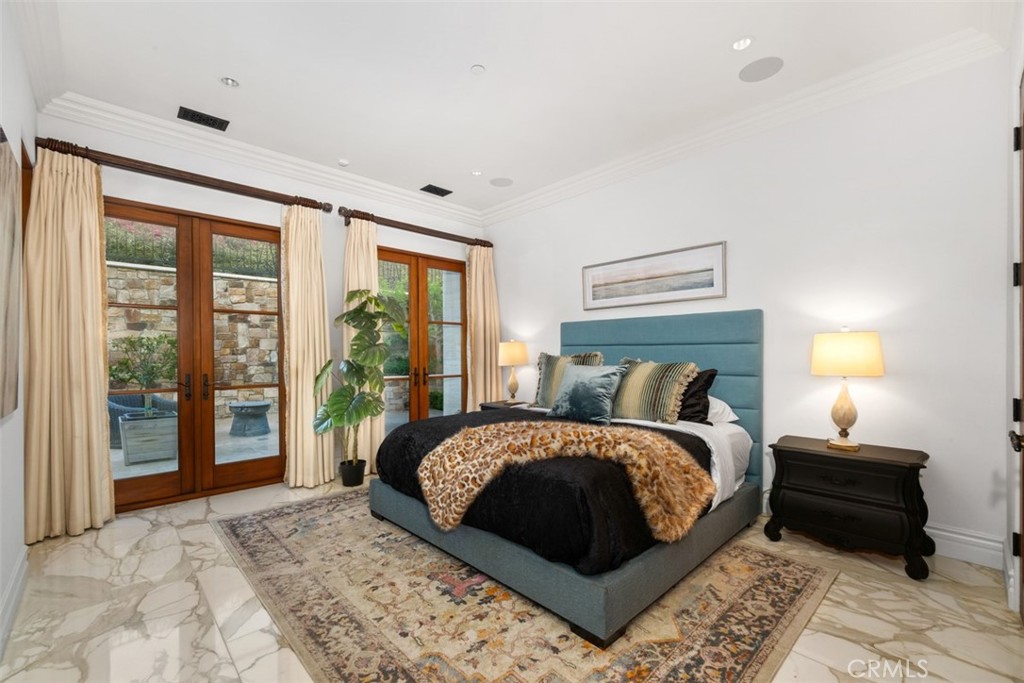 32040 Cape Point Drive Rancho Palos Verdes, CA 90275 - Photo 59 of 70 a bedroom with a large bed and a large window