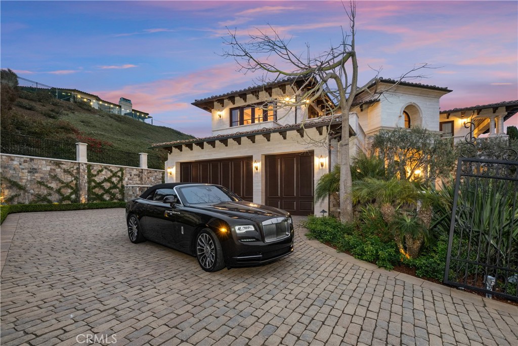32040 Cape Point Drive Rancho Palos Verdes, CA 90275 - Photo 70 of 70 a car parked in front of a house