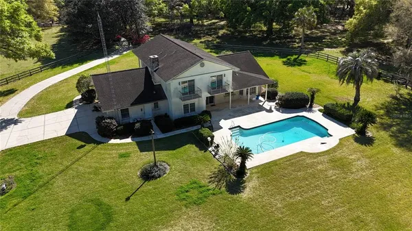 a view of swimming pool with a garden