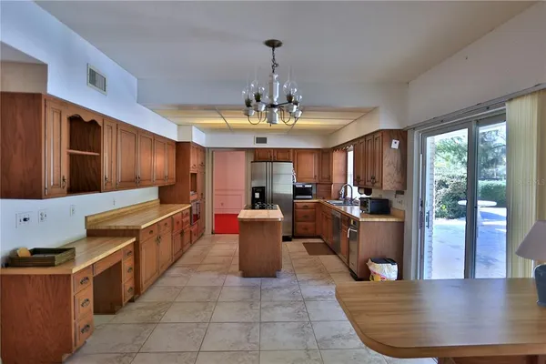 a view of a dining room kitchen and windows